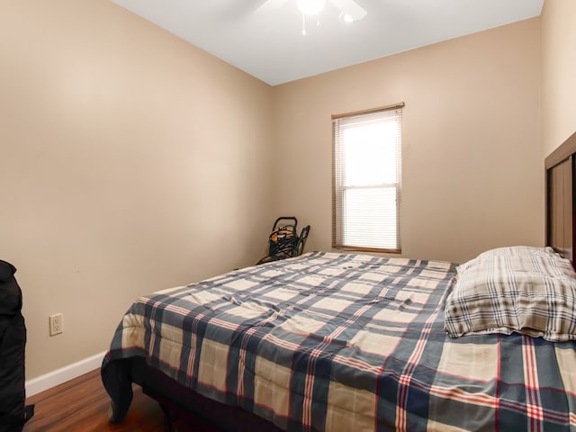 bedroom featuring wood-type flooring and ceiling fan