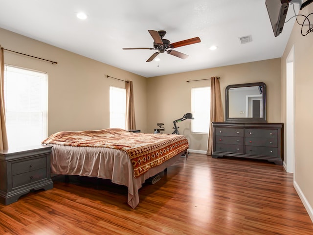 bedroom featuring ceiling fan and dark hardwood / wood-style floors