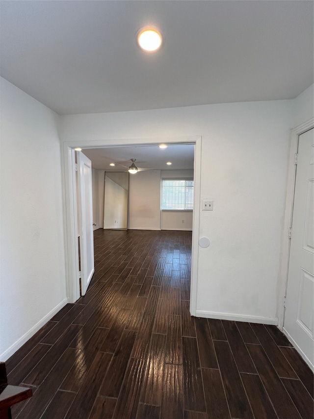 hallway with dark wood-type flooring