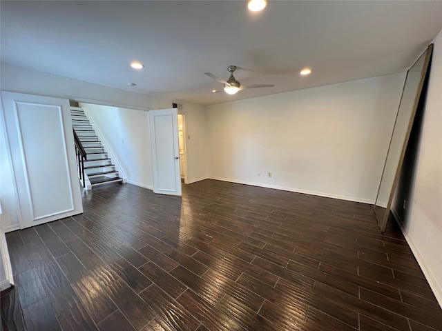 interior space with ceiling fan and dark hardwood / wood-style flooring