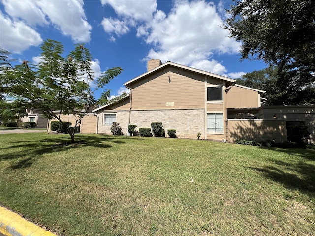 view of home's exterior with a yard