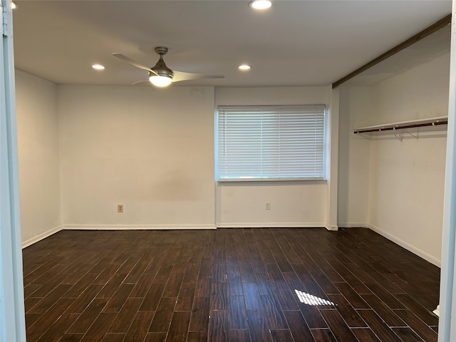 interior space with ceiling fan and dark hardwood / wood-style flooring