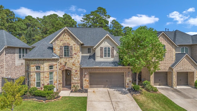 view of front of house with a front yard and a garage