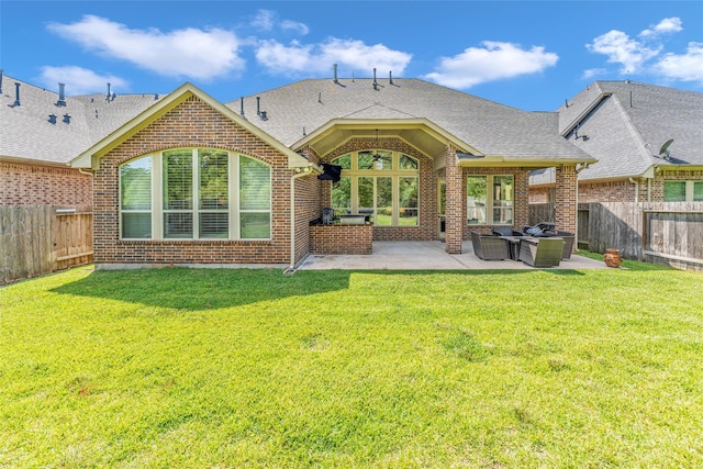 back of house featuring a lawn, an outdoor living space, and a patio area