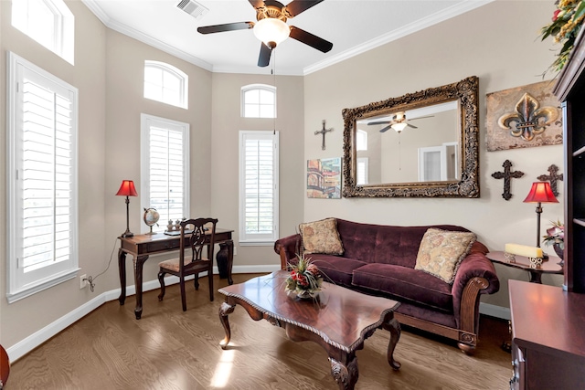 living room featuring hardwood / wood-style flooring, ceiling fan, and ornamental molding