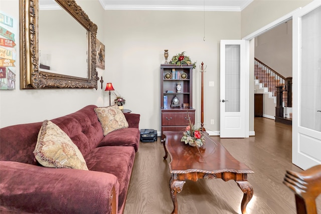 living room featuring dark hardwood / wood-style floors and ornamental molding