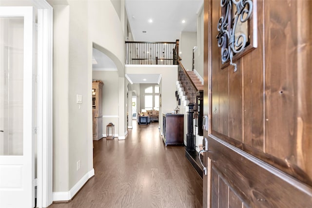 foyer entrance featuring dark hardwood / wood-style flooring and crown molding