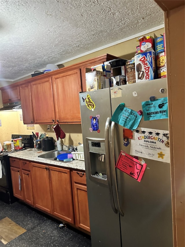 kitchen with sink, a textured ceiling, electric range, and stainless steel fridge