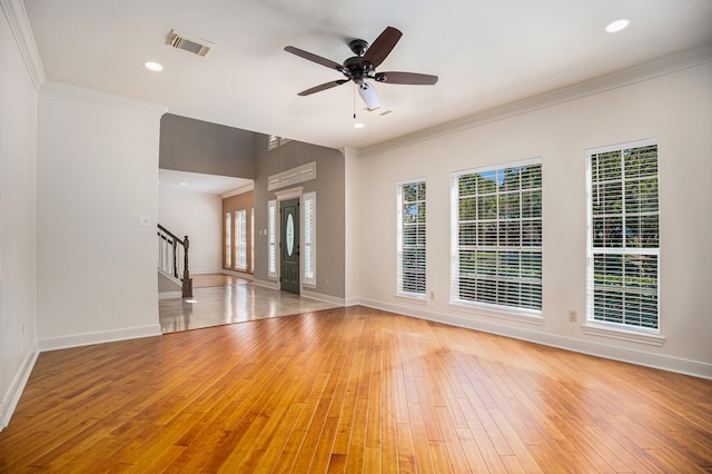 unfurnished living room with ceiling fan, light hardwood / wood-style flooring, and a wealth of natural light