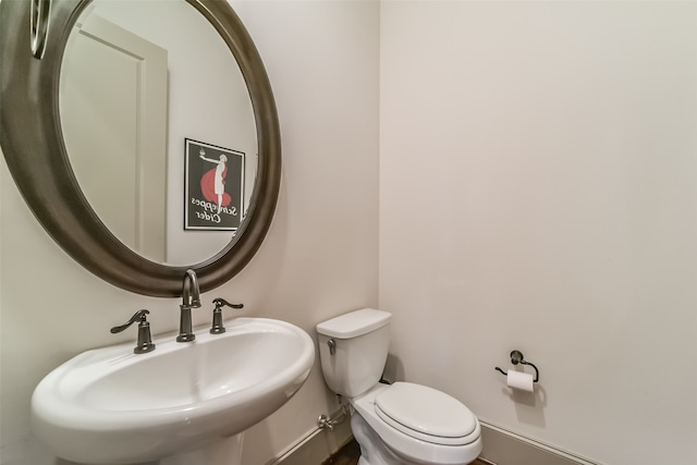 bathroom featuring sink and toilet