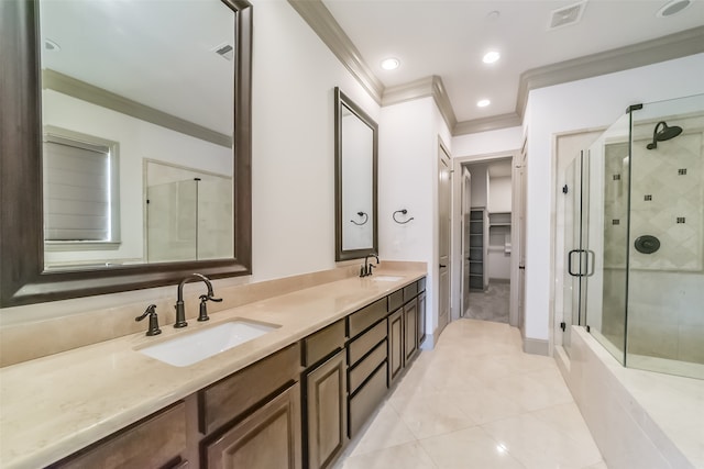 bathroom with tile patterned floors, crown molding, a shower with door, and vanity