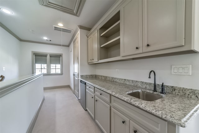 kitchen featuring light stone countertops, light carpet, dishwasher, and sink