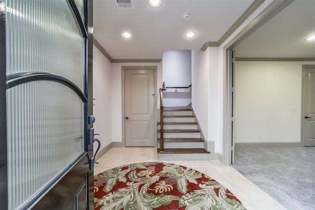 tiled entryway with crown molding