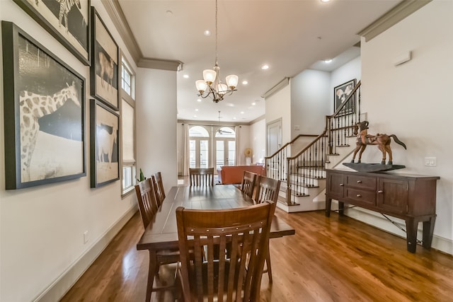 dining room with a notable chandelier, wood-type flooring, and french doors