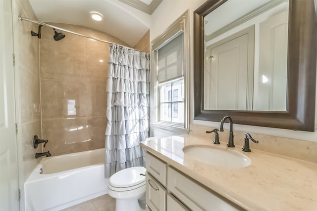 full bathroom with vanity, vaulted ceiling, shower / bath combo with shower curtain, tile patterned flooring, and toilet