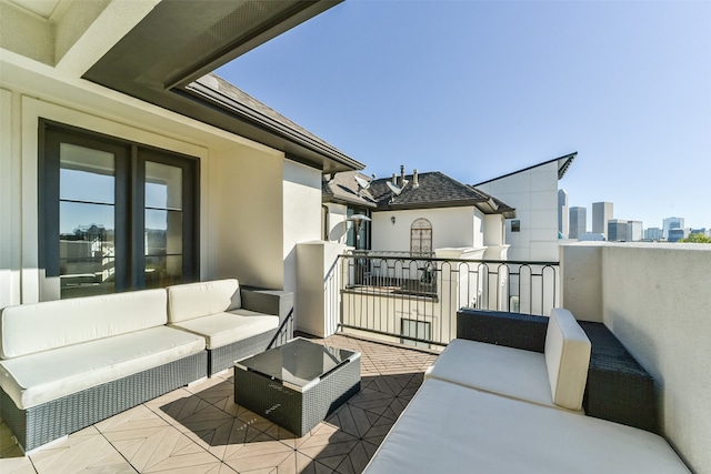 view of patio featuring outdoor lounge area and a balcony