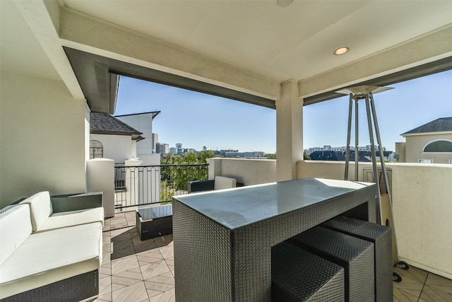 view of patio with outdoor lounge area and a balcony