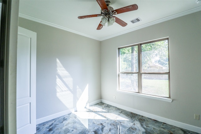 spare room featuring ornamental molding and ceiling fan