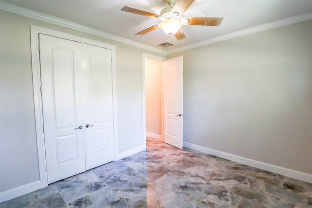 unfurnished bedroom with ceiling fan, a closet, and crown molding