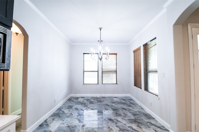 unfurnished dining area with crown molding and a chandelier