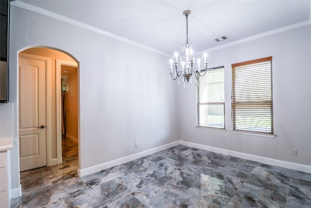 empty room with a notable chandelier and crown molding