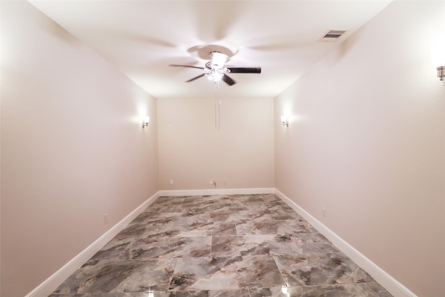 spare room with ceiling fan