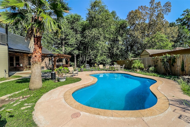 view of pool with a pergola and a patio area