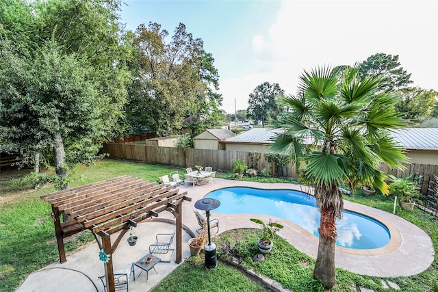 view of pool featuring a lawn and a patio area