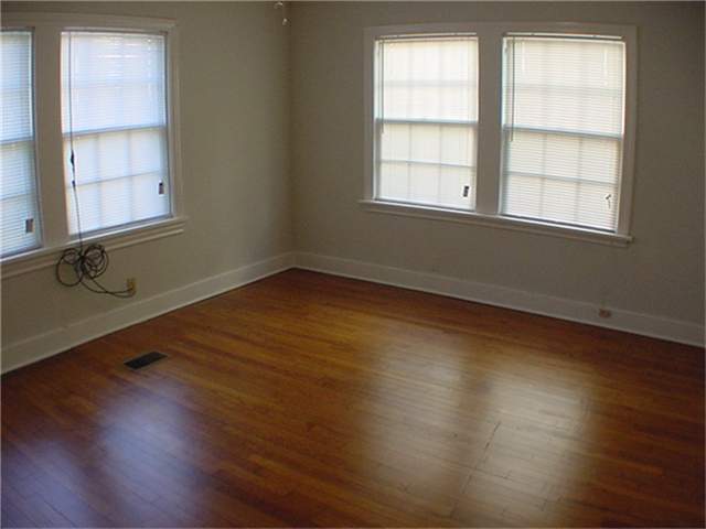 empty room featuring dark hardwood / wood-style flooring