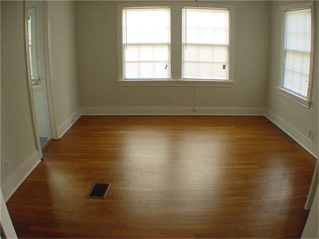 empty room with dark wood-type flooring