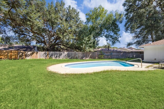 16007 Soma Dr, Houston, TX 77083 - view of swimming pool with a fenced backyard, a fenced in pool, and a lawn