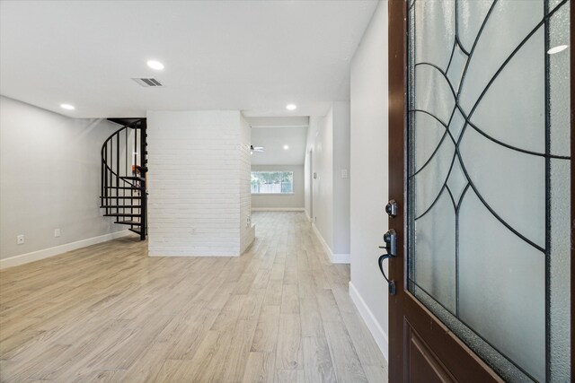 entryway with light hardwood / wood-style floors