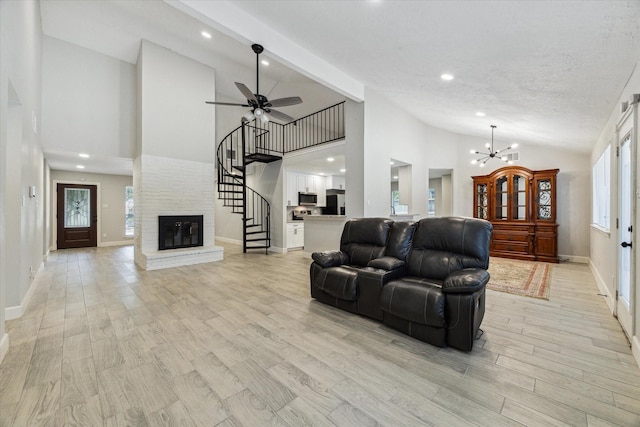 16007 Soma Dr, Houston, TX 77083 - living area featuring high vaulted ceiling, stairs, and baseboards