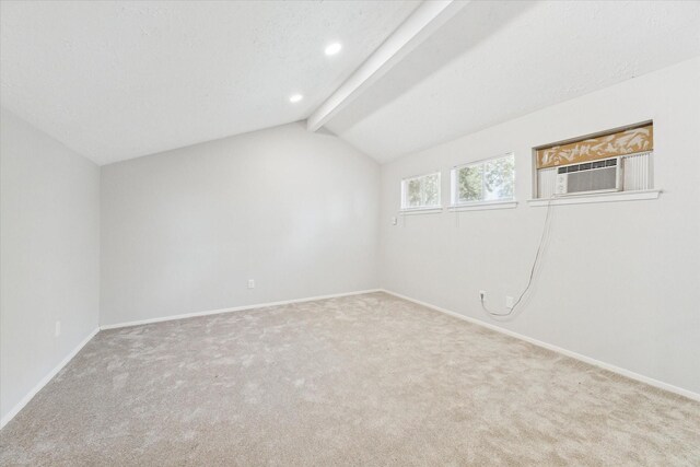 interior space featuring lofted ceiling with beams