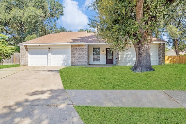 16007 Soma Dr, Houston, TX 77083 - ranch-style home featuring a front lawn, a garage, brick siding, concrete driveway, and fence