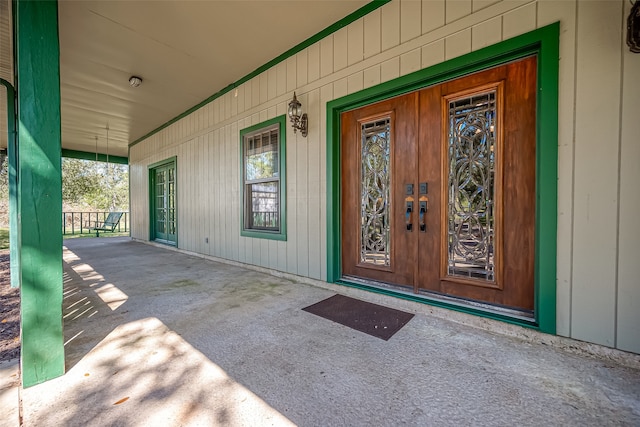 view of exterior entry with a porch