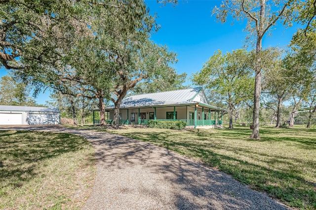 view of front of house with a porch and a front yard