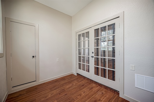 interior space featuring dark hardwood / wood-style flooring and french doors