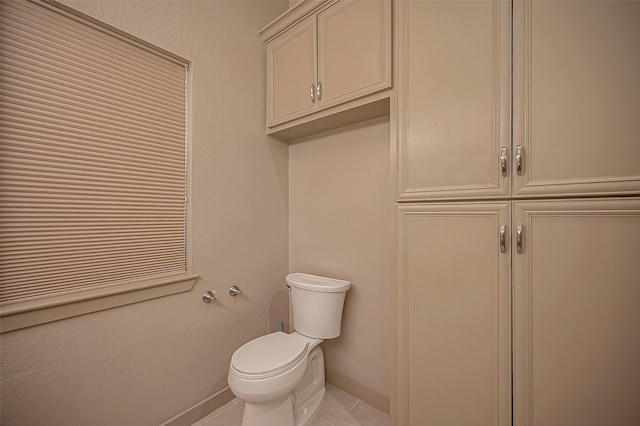 bathroom with tile patterned floors and toilet