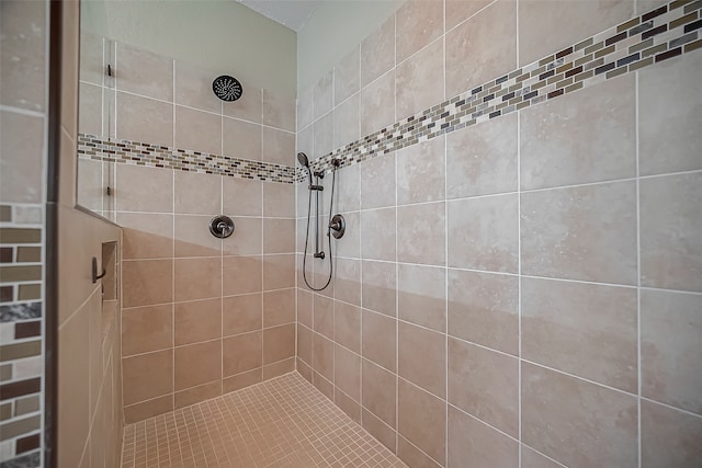 bathroom featuring tiled shower