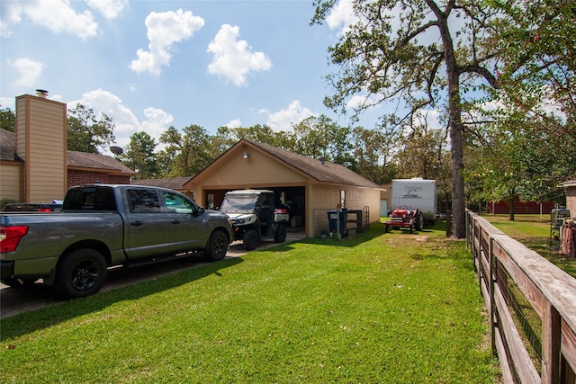 view of yard featuring an outbuilding and a garage