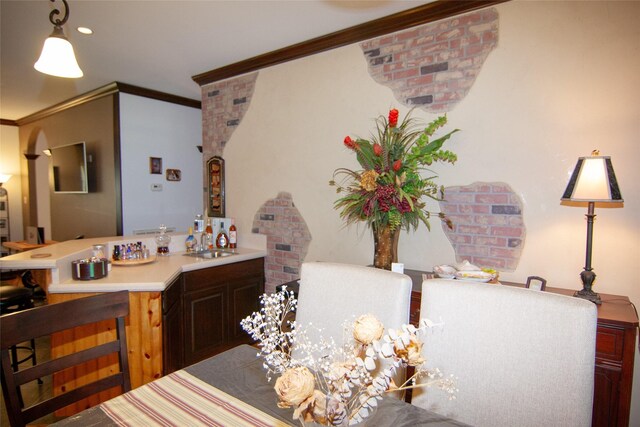 bathroom with ornamental molding, a sink, and recessed lighting
