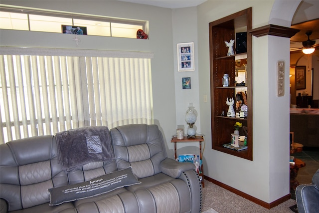 living room featuring ceiling fan and carpet flooring