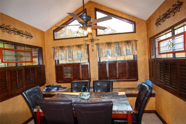 interior space with a wealth of natural light, vaulted ceiling, ceiling fan, and a textured wall