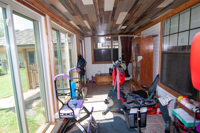 workout area featuring wooden ceiling