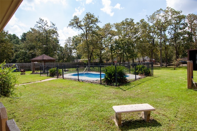 view of swimming pool with a lawn