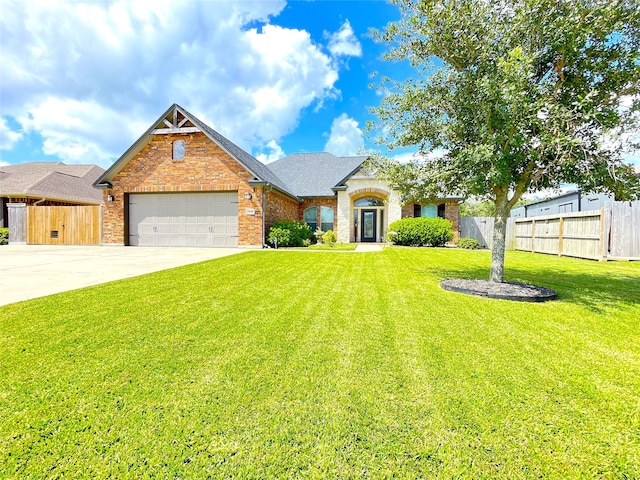 view of front of house with a front yard and a garage