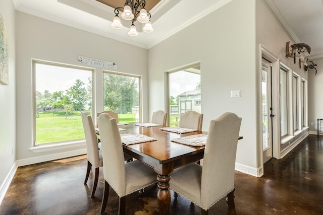 308 Creekside Ln, Lake Jackson, TX 77566 - dining area featuring finished concrete floors, plenty of natural light, baseboards, ornamental molding, and a chandelier