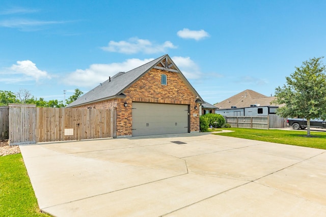 308 Creekside Ln, Lake Jackson, TX 77566 - view of side of home featuring brick siding and a garage