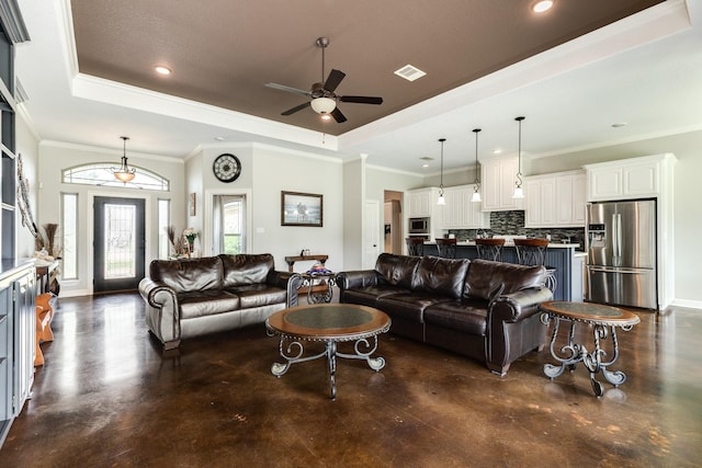308 Creekside Ln, Lake Jackson, TX 77566 - living room featuring a raised ceiling, a ceiling fan, finished concrete floors, recessed lighting, and ornamental molding